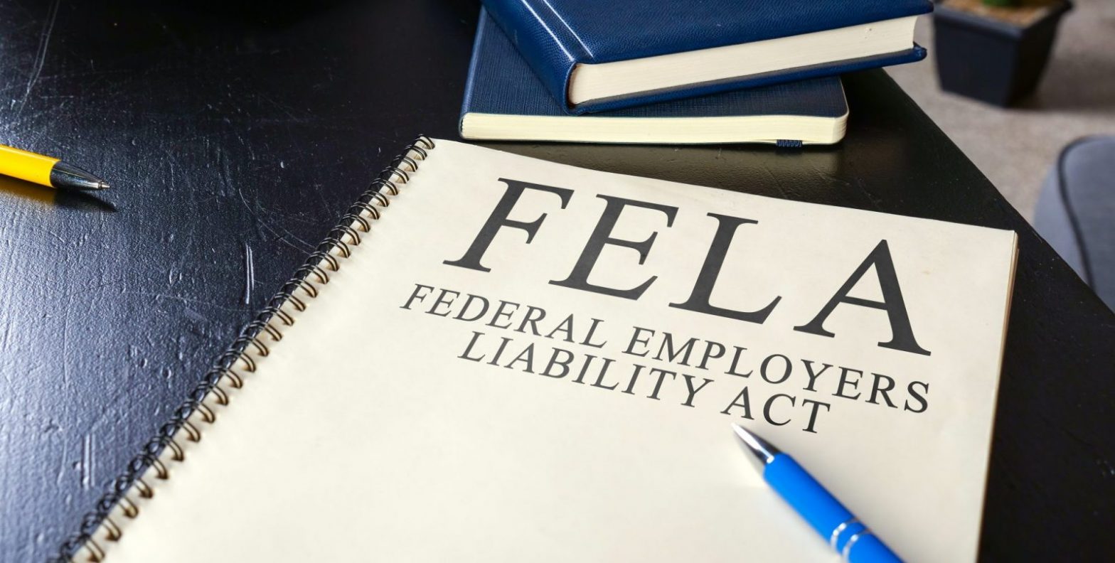 FELA notebook on lawyer desk to represent FELA Claim Attorney Newport News.